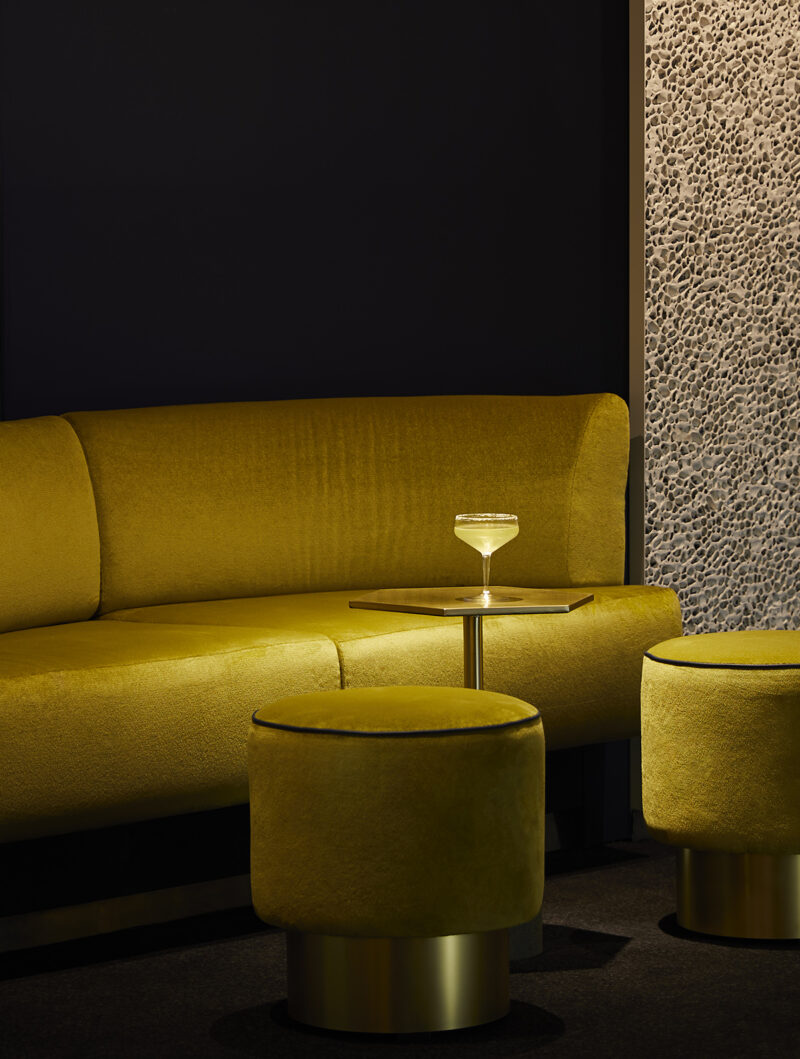 Seating area and cocktail at On the Rocks Bar