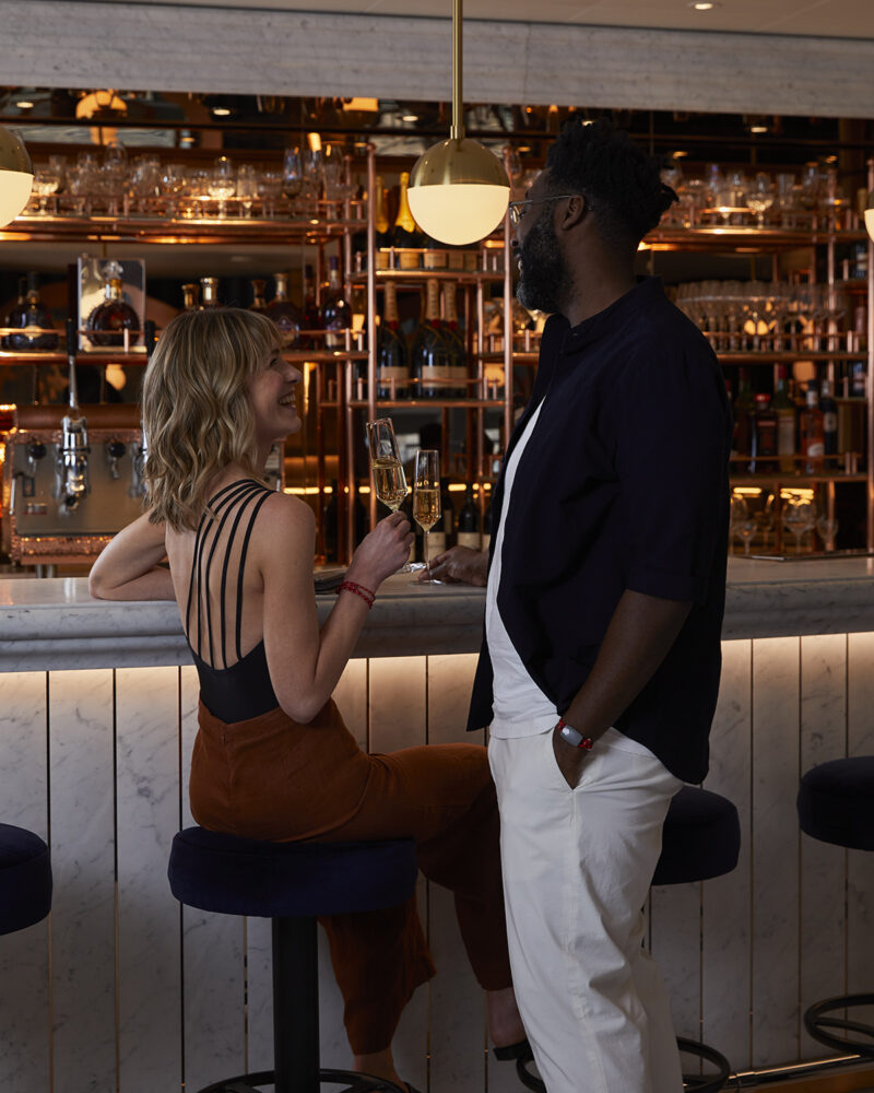 Two people drinking champagne at SIP Lounge bar