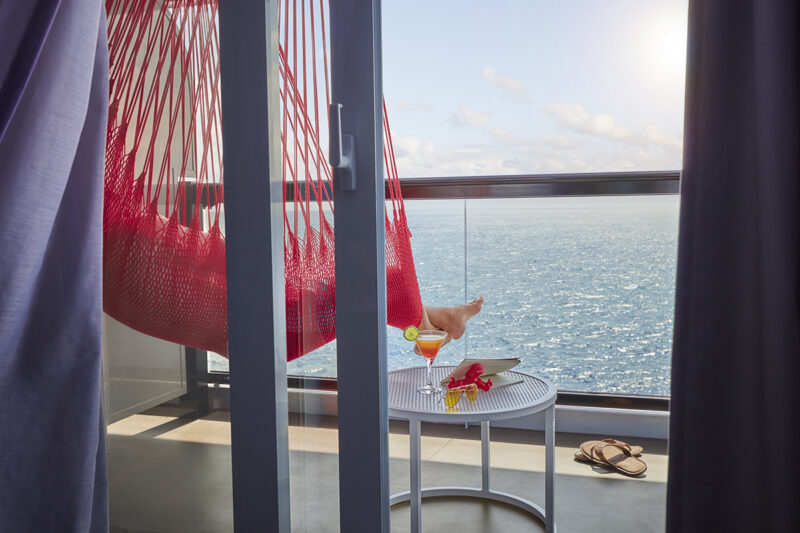 Legs in a hammock on a terrace onboard Scarlet Lady.  Photoshoot of Vitamin Sea activities by Melanie Acevedo onboard Scarlet Lady, Virgin Voyages
Photoshoot of Vitamin Sea activities by Melanie Acevedo onboard Scarlet Lady, Virgin Voyages
Vitamin Sea & Project Jackson Photoshoot Cabins onboard SCL  Shoot Date: Sept 18-25, 2021
Shoot Location: Transit from NY-Bimini  Usage: Worldwide/universal unlimited rights in perpetuity for all media including 3rd party usage (Virgin Brands) for all footage and images captured during the shoot. Excluding TV + Broadcast.
Talent Usage: 5 Years Worldwide/universal unlimited rights in perpetuity for all media including 3rd party usage for all footage and images captured during the shoot. Excluding TV + Broadcast. 
TEAM
Photographers:
Lifestyle: Melanie Acevedo
Cabins: Sang An
Agent: Kenna Zimmer, Sarah Laird & Good Company
https://sarahlaird.com  CD: Christian Schrader
Art Buyer / Producer: Kathy Boos